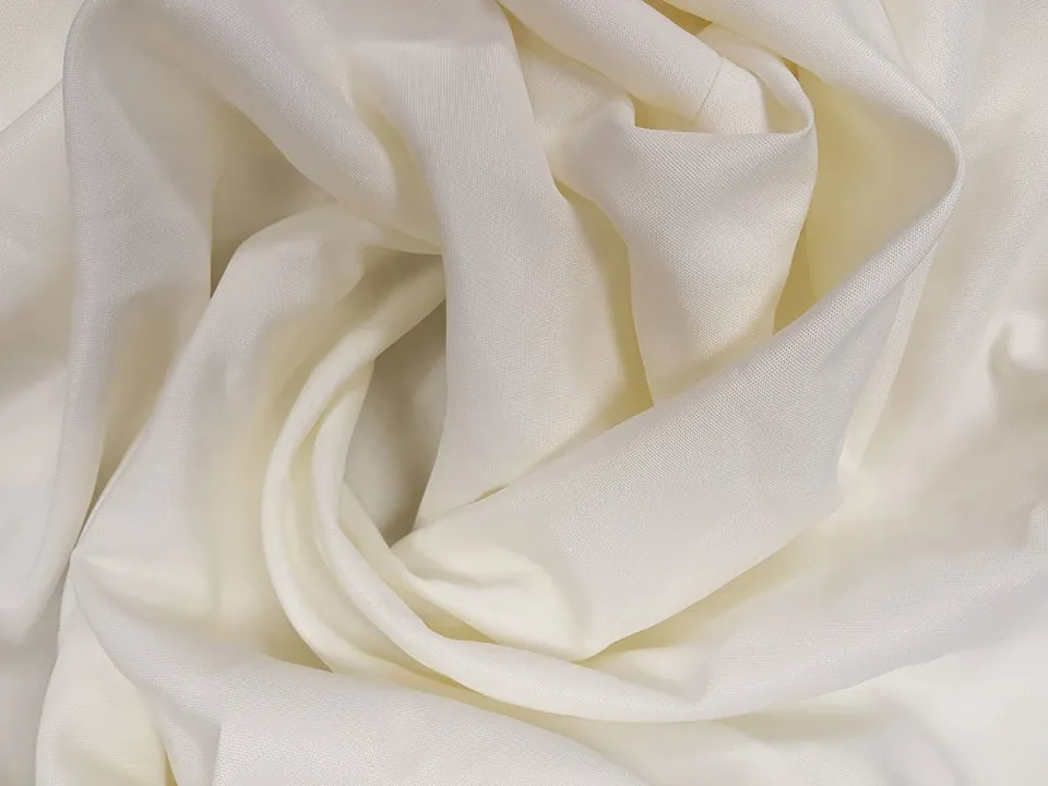 Close-up of ivory polyester tablecloth fabric